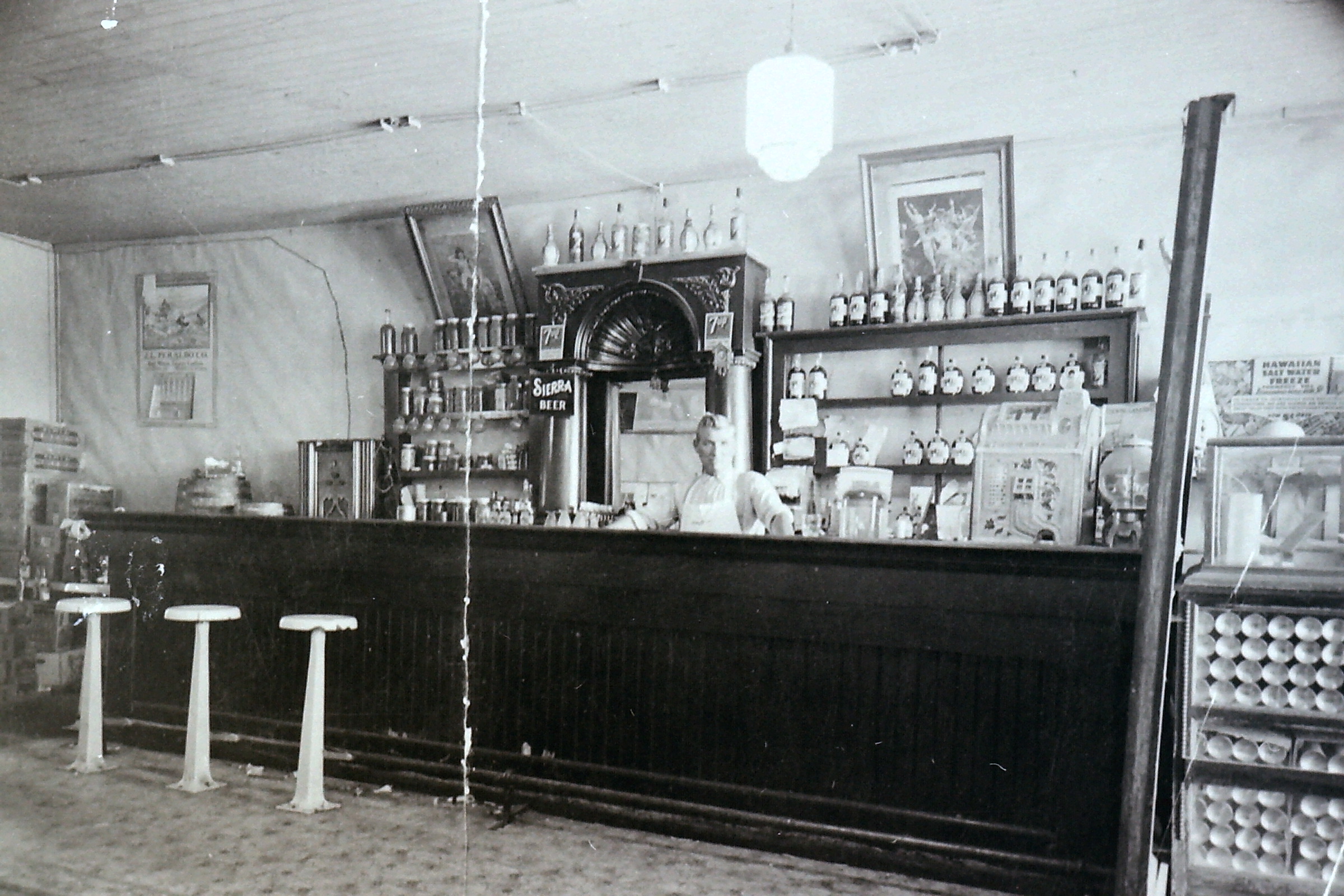 Angelo Isola behind the bar of Pacini and Isola’s saloon
